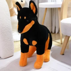 Outlet La compagnie de la peluche Peluche chien doberman noir et marron assis