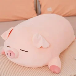 La compagnie de la peluche Peluche cochon rose allongé qui dort