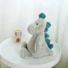 Best La compagnie de la peluche Peluche dinosaure petit bleu et gris