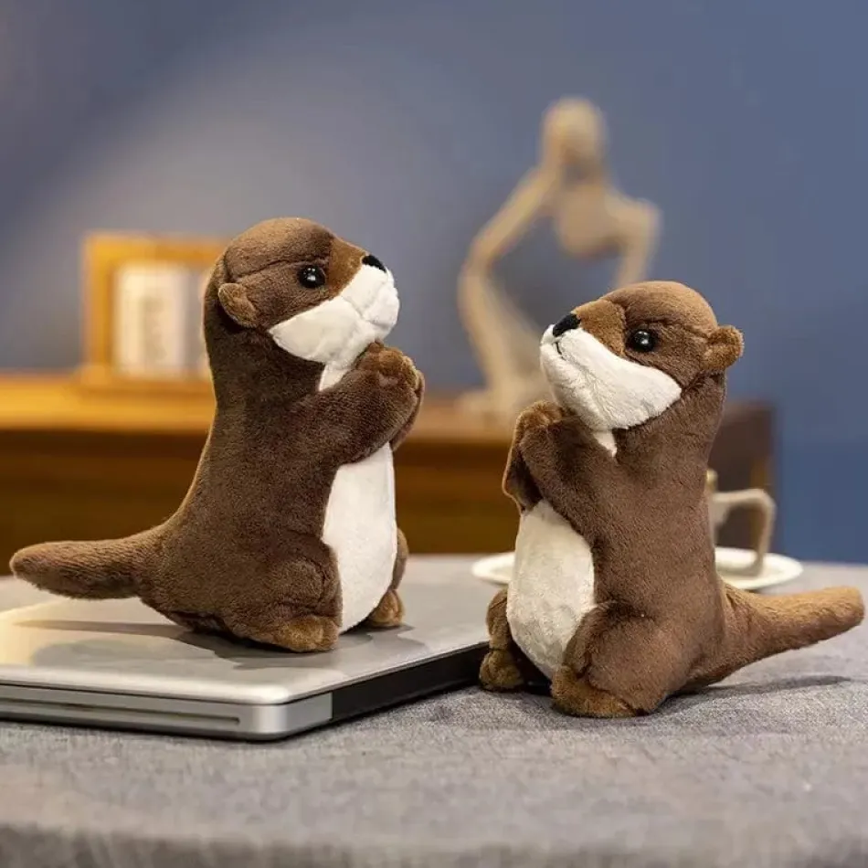 La compagnie de la peluche Peluche loutre aux mains jointes