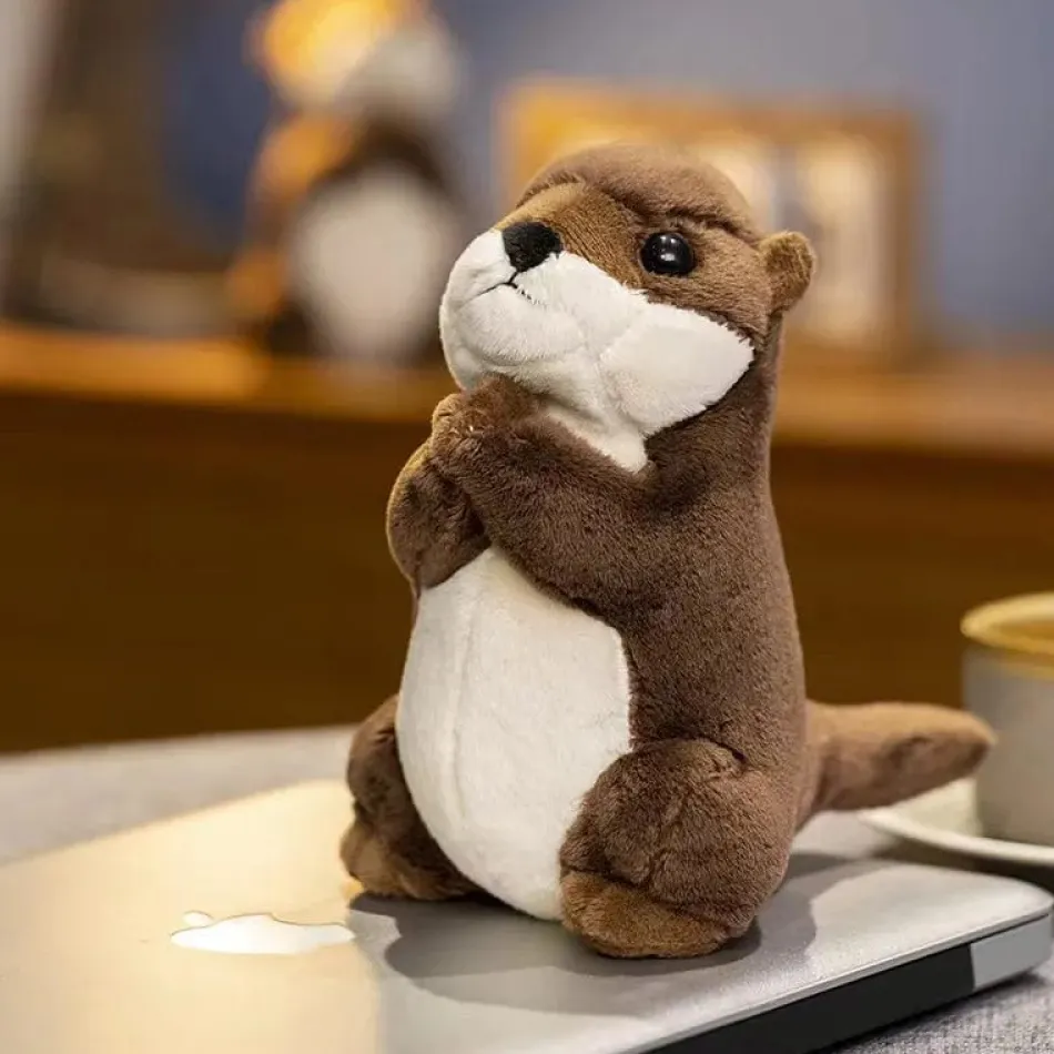 La compagnie de la peluche Peluche loutre aux mains jointes