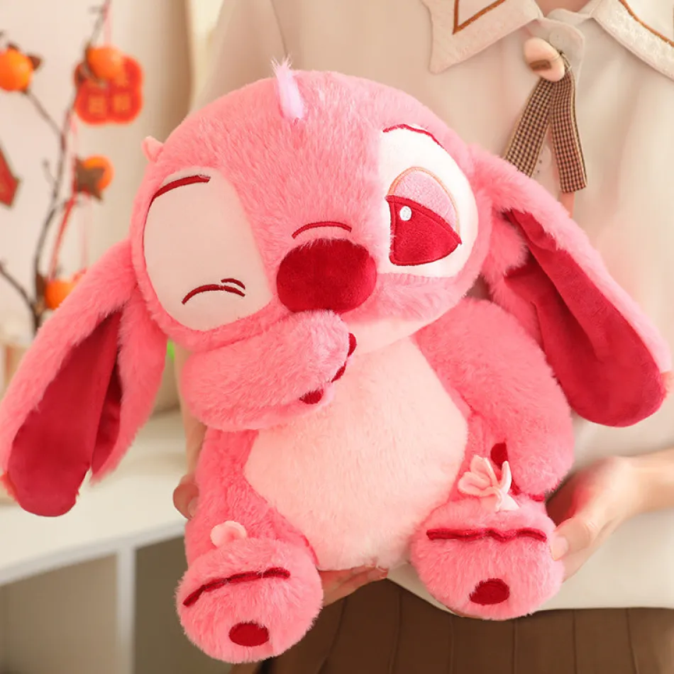 Online La compagnie de la peluche Peluche Stitch Angel rose douce et mignonne avec clin d'œil
